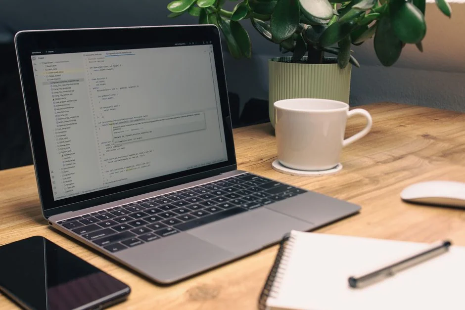 Businesswoman working on laptop with Android 6.0 Marshmallow webpage open.